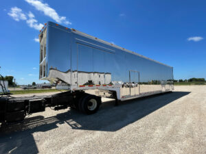 Penske trailer leaving production plant